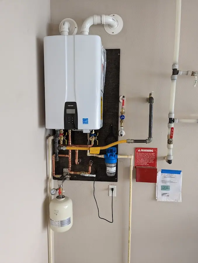 Professional plumber installing copper piping in a Westlake home